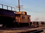 CO 903525 brings up the rear of a southbound train while SBD 785 works the yard